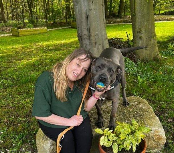 Person with dog outside