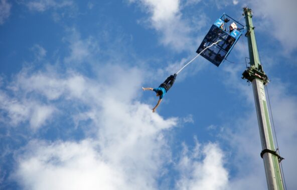 Someone bungee jumping from below