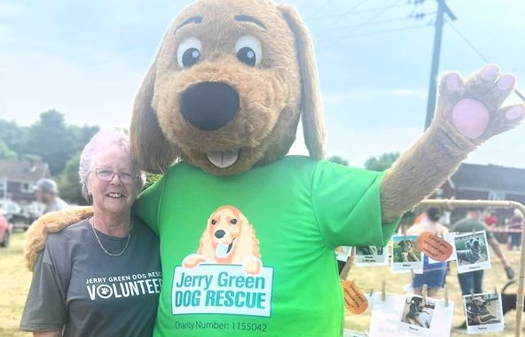Jerry Green Dog Rescue mascot with volunteer.